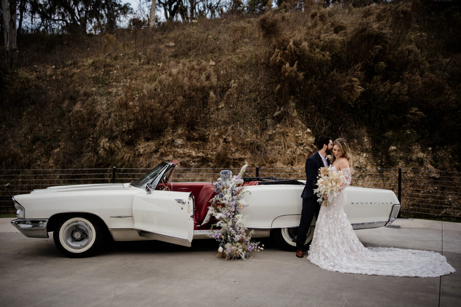 couple pose for ethereal wedding 